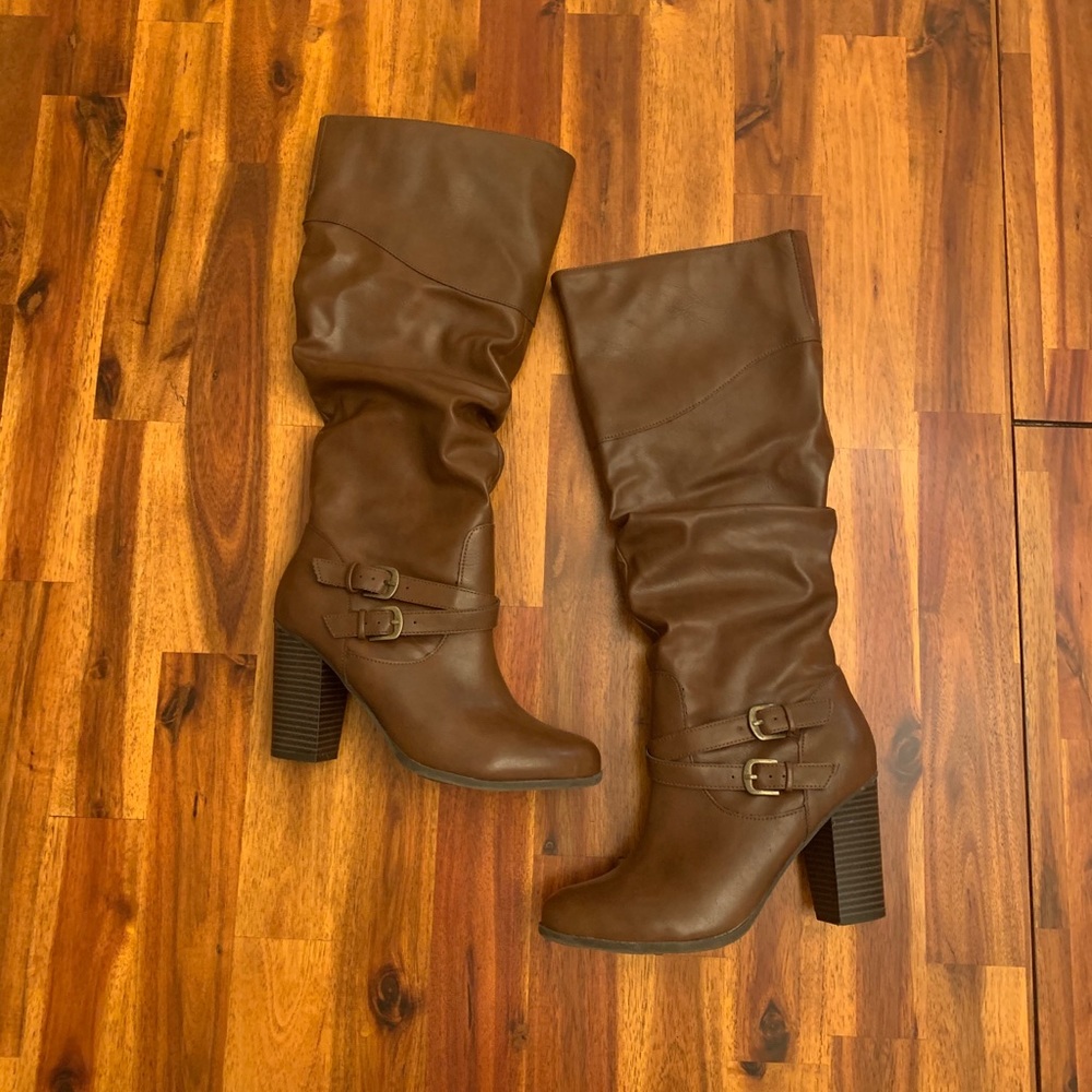 Tall heeled brown boots with side zipper